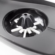 Close-up view of the Valken V-MAX Plus loader's internal paddle wheel feed system, a fan-shaped rotating mechanism that ensures smooth, high-speed paintball feeding without jams.

