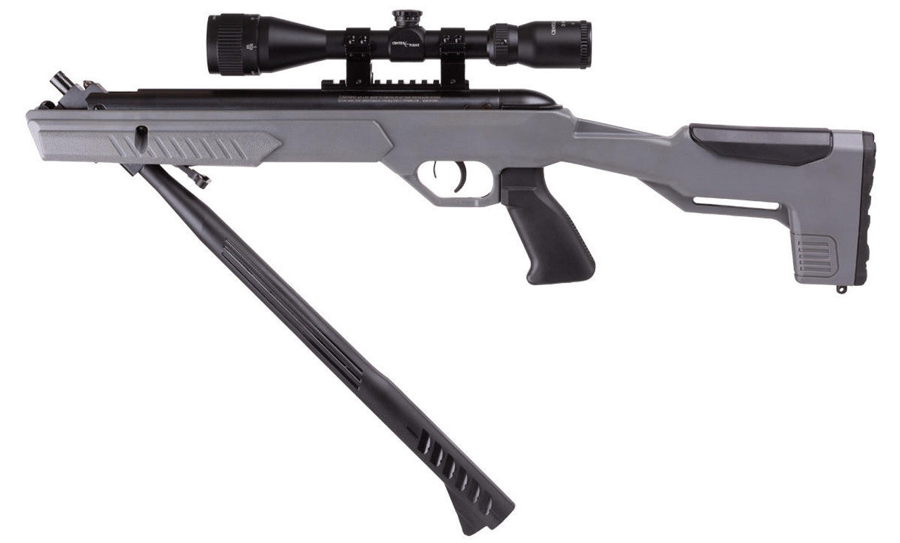 A sleek Crosman MAG-Fire Extreme air rifle, showcasing its precise scope, ergonomic trigger, sturdy pistol grip, and crafted rifle stock, as the front barrel is smoothly pulled down to cock the powerful break barrel mechanism.