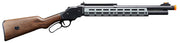 A.T.87 gas-powered airsoft shotgun laid out with included shells and manual