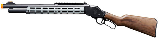 A.T.87 gas-powered airsoft shotgun laid out with included shells and manual